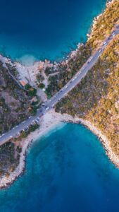 Stunning aerial view of the turquoise waters and rugged coast in Kaş, Antalya.